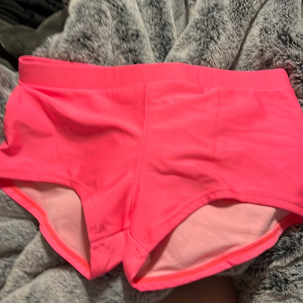 Neon pink swim shorts